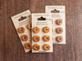 3 lots of 6 handmade yew wood buttons by tom dyson on a brown backing card