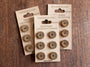 3 lots of 6 handmade laburnum wood buttons by tom dyson on a brown backing card
