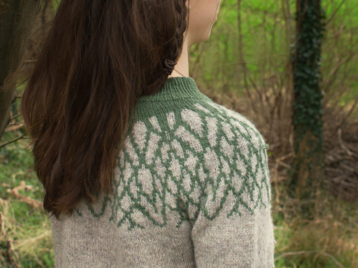 A close up of the shoulder of Boskular – a yoked colourwork jumper inspired by tree branches