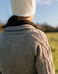 a close up shot of the shoulder and collar detail on a handknit cardigan made using British wool